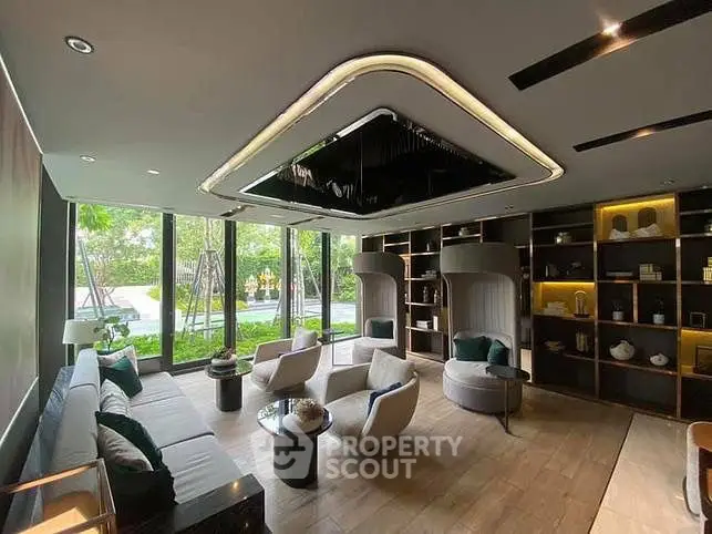 Luxurious living room with modern design and garden view, featuring elegant furniture and stylish decor.
