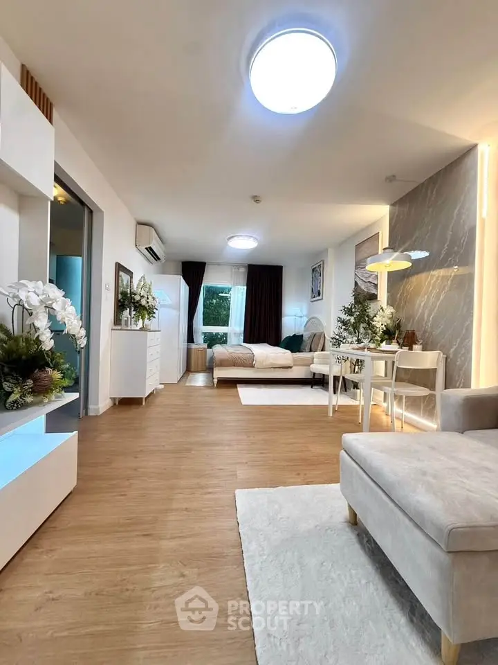 Spacious modern living room with elegant decor and natural light