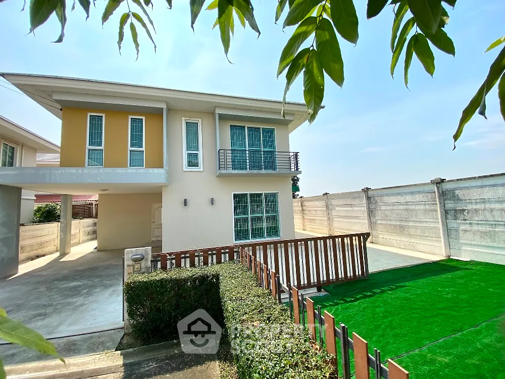 Modern two-story house with spacious driveway and green lawn