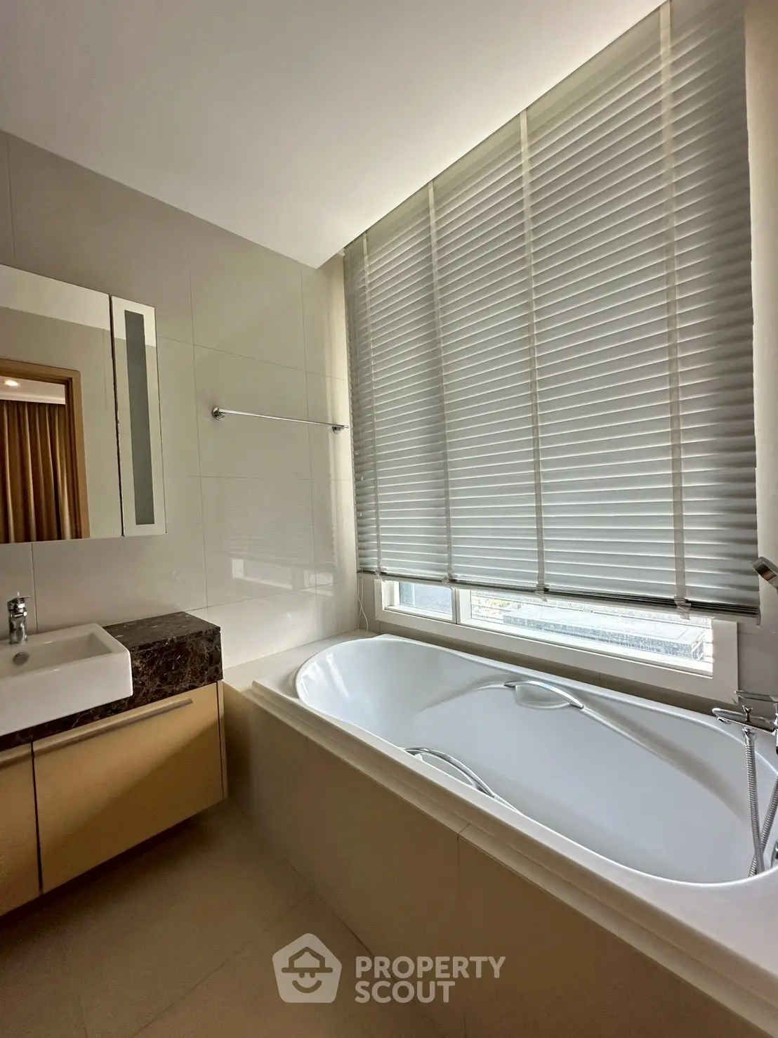 Luxurious bathroom with elegant bathtub and modern fixtures, perfect for relaxation and comfort.