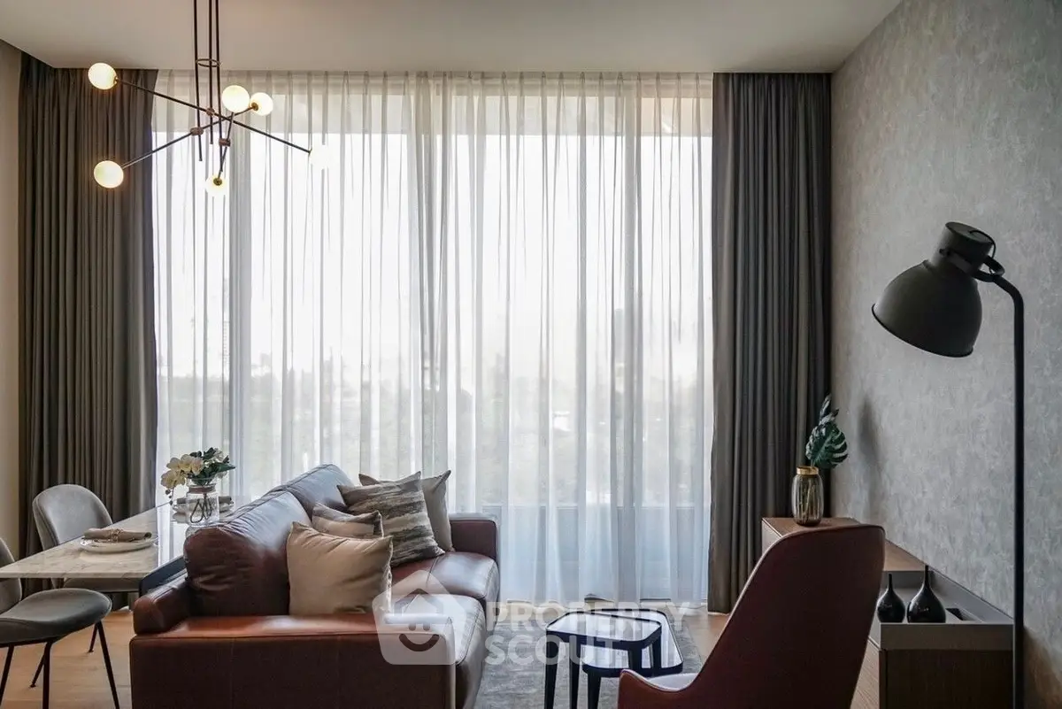 Stylish modern living room with elegant lighting and floor-to-ceiling windows