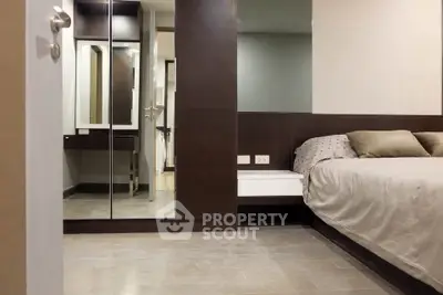 Modern bedroom with sleek wooden accents and mirrored wardrobe