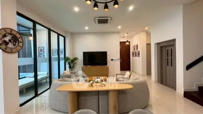 Spacious modern living room with elegant decor and natural light