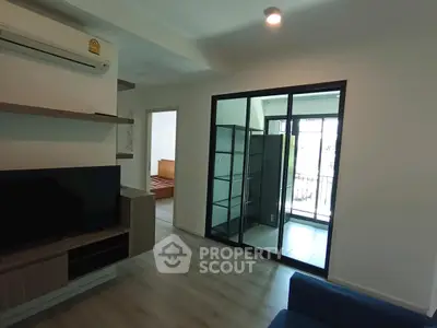 Modern living room with sleek design and balcony access