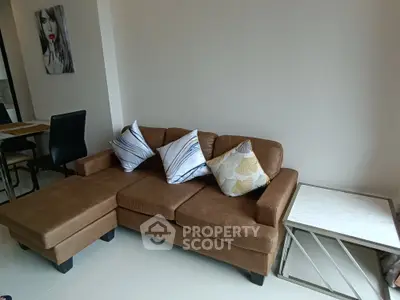 Modern living room with stylish brown leather sofa and elegant decor