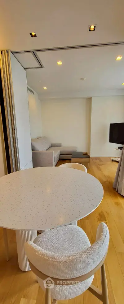 Modern living room with stylish furniture and wooden flooring