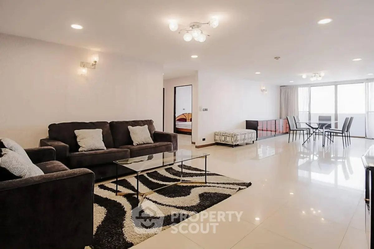 Spacious modern living room with elegant decor and dining area