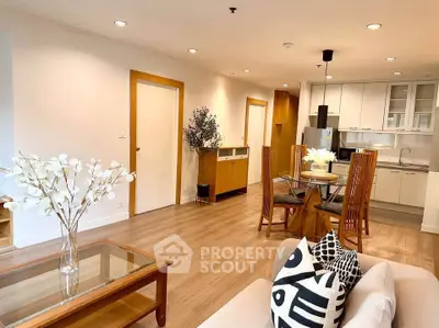 Spacious open-plan living room with modern kitchen and stylish decor