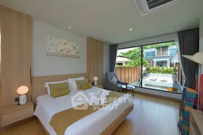 Luxurious bedroom with large window and modern decor in a serene setting.