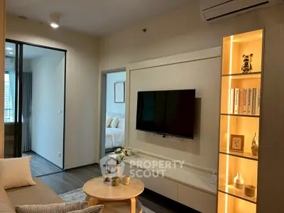 Modern living room with sleek TV setup and cozy decor