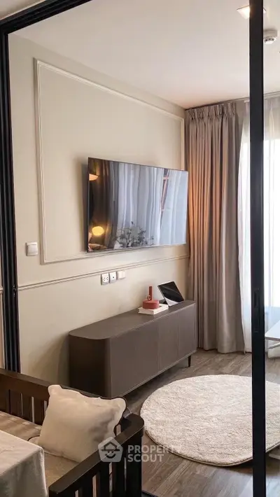 Modern living room with wall-mounted TV and elegant decor