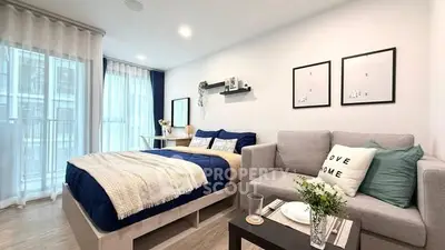 Modern studio apartment with cozy living area and stylish decor