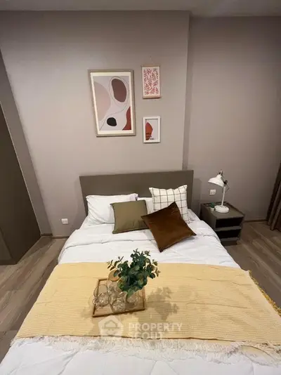Cozy bedroom with modern decor and stylish artwork