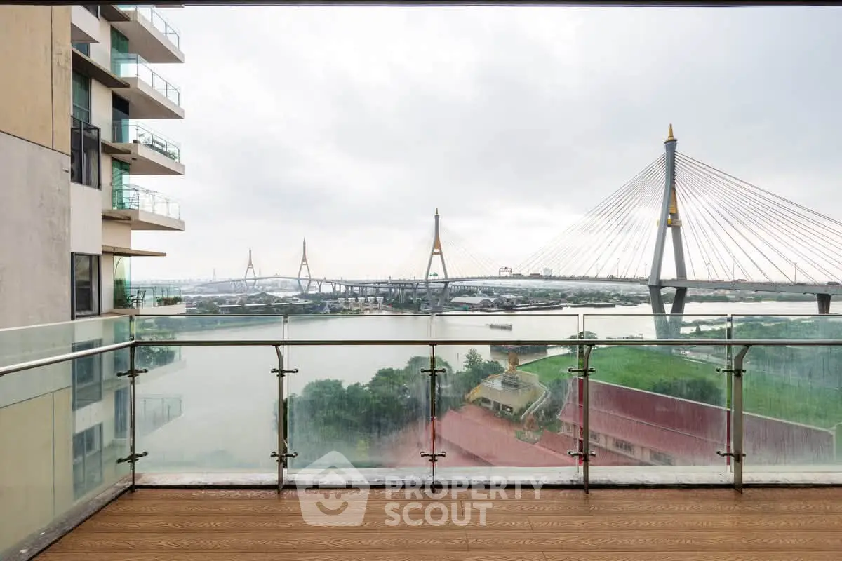 Stunning balcony view of river and bridge from modern apartment