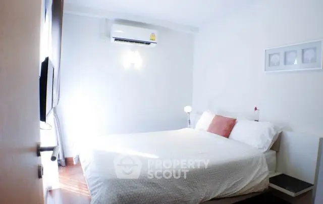 Cozy and bright bedroom with modern decor and air conditioning