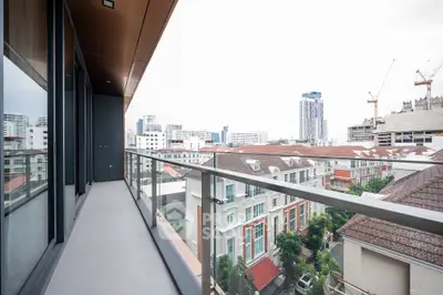 Spacious balcony with stunning cityscape view in modern urban apartment