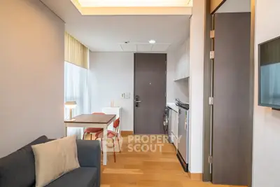 Modern apartment interior with cozy living area and compact kitchen