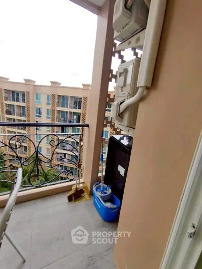 Charming balcony with elegant railing and city view, perfect for relaxation in a modern apartment.