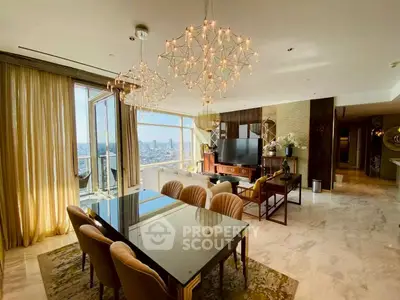 Luxurious open-plan living and dining area with stunning city views and elegant lighting.