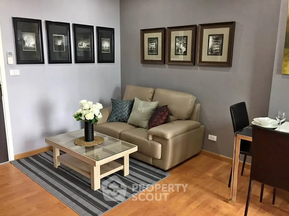 Cozy living room with modern decor and comfortable seating in a stylish apartment.