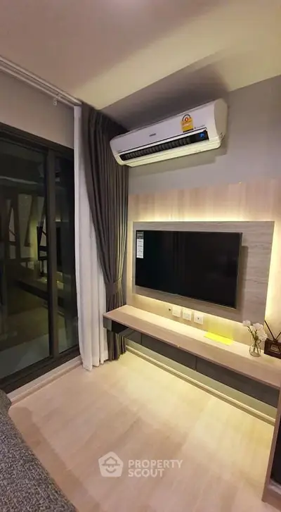 Modern living room with air conditioning and sleek TV setup