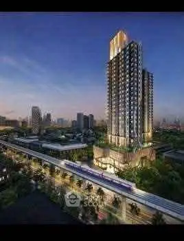 Stunning high-rise building with cityscape view at dusk, showcasing modern urban living.