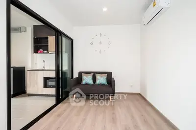 Modern living room with sleek design and open kitchen layout