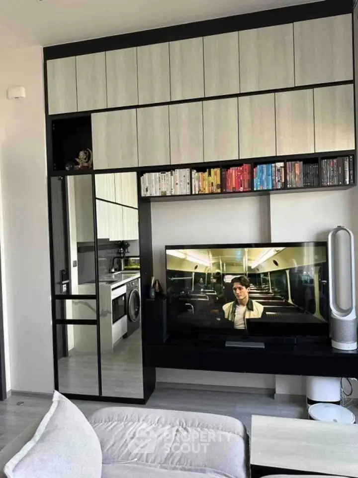 Modern living room with sleek entertainment center and built-in storage