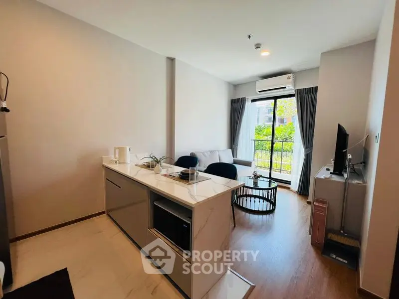 Modern living room with open kitchen and garden view