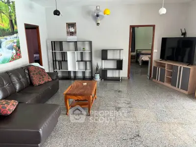 Spacious living room with modern furniture and natural light