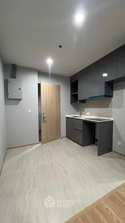 Modern compact kitchen with sleek cabinets and minimalist design