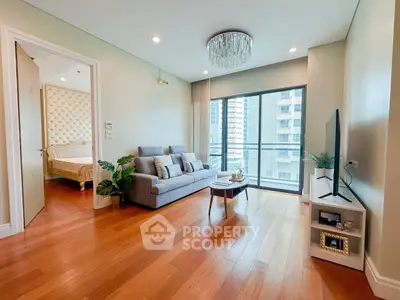 Spacious living room with modern decor and balcony view in luxury apartment