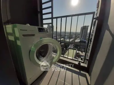 Modern balcony with washing machine and city view, perfect for urban living.