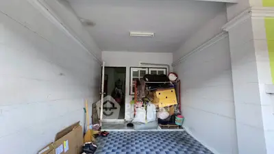 Spacious storage area with tiled floor and ample space for organization.