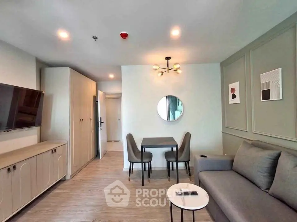 Modern living room with stylish decor and cozy seating area in a contemporary apartment.