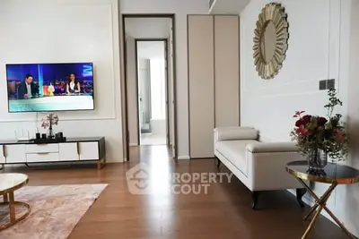 Modern living room with stylish decor and wall-mounted TV