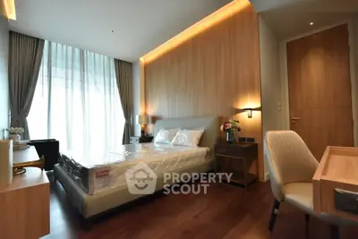 Luxurious bedroom with modern decor and large window in upscale apartment