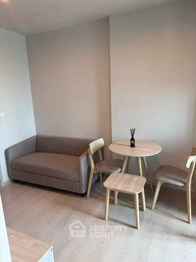 Modern living room with cozy sofa and dining set in minimalist design