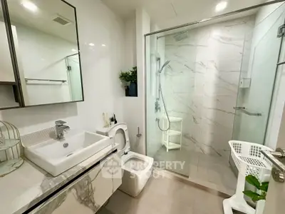 Modern bathroom with sleek design and glass shower enclosure
