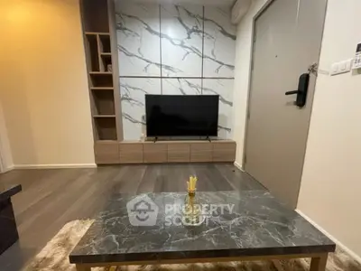 Modern living room with marble accents and sleek TV setup