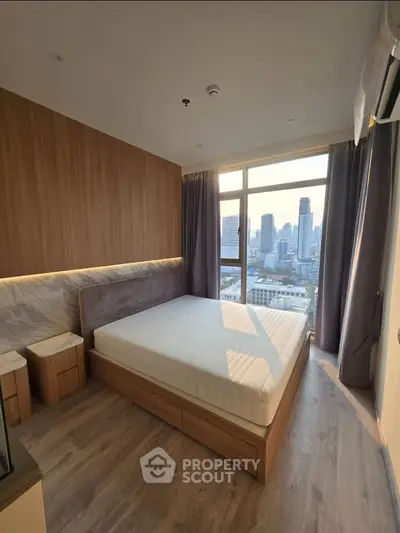Modern bedroom with city view and stylish wooden accents