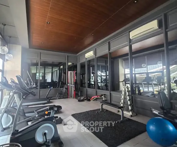 Modern gym with state-of-the-art equipment and stylish interior design.