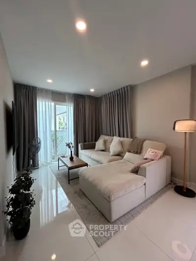 Modern living room with cozy sectional sofa and elegant decor