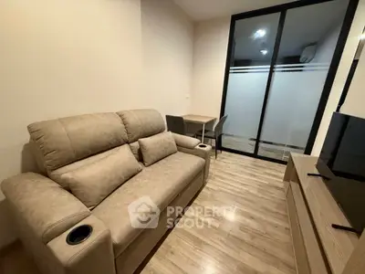 Cozy living room with modern beige sofa and sleek wooden flooring