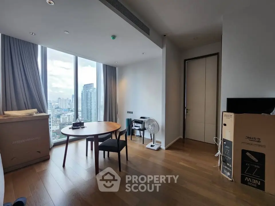 Modern apartment with city view, featuring wooden floors and large windows, ideal for urban living.