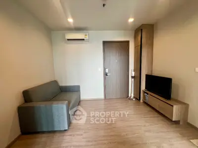 Modern living room with sleek furniture and air conditioning unit