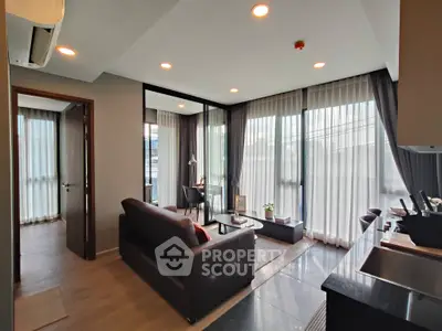 Modern living room with sleek design and abundant natural light