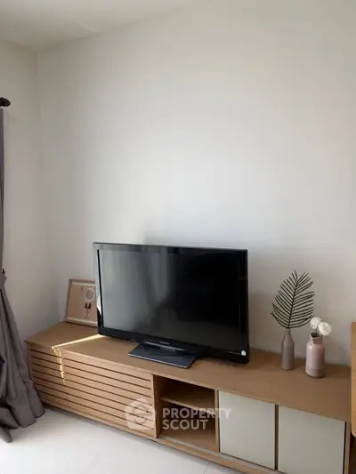 Modern living room with sleek TV stand and minimalist decor