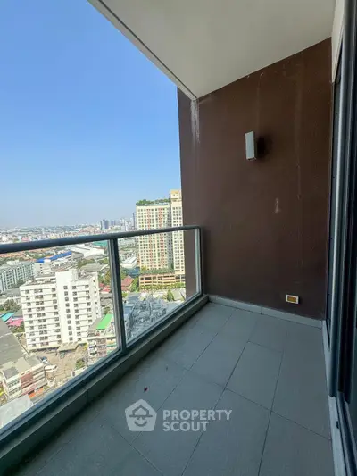 Spacious balcony with stunning city view in high-rise apartment