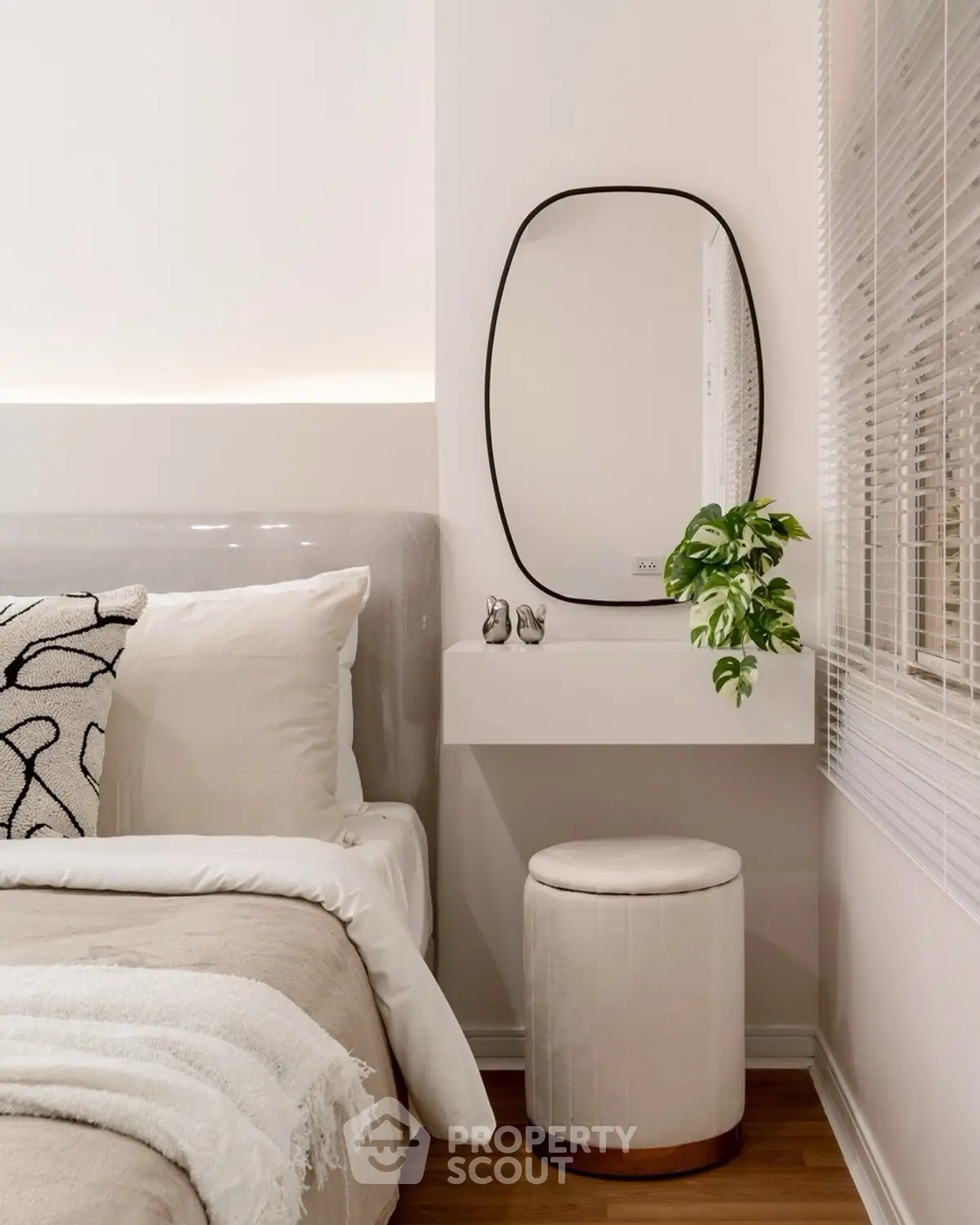 Elegant bedroom corner with stylish decor and cozy bedding